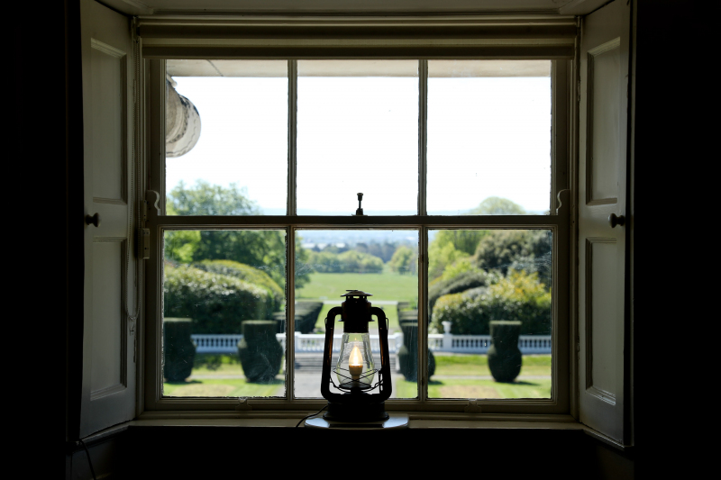 Photo by Richie McCann, of a lamp in the window of the president's residence in Dublin, Ireland.